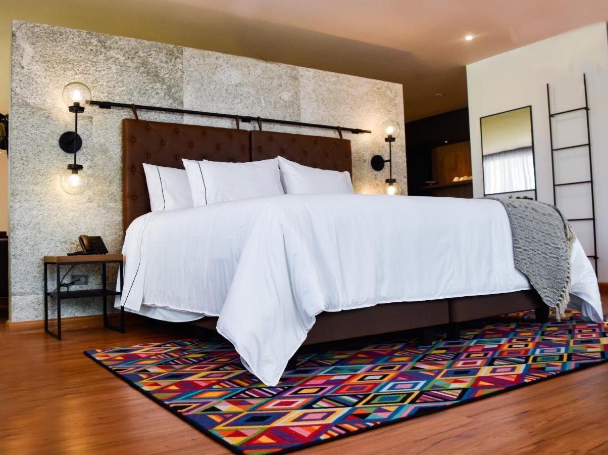 Hotel V1501 باستو المظهر الخارجي الصورة A bedroom with a carpet